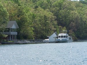 A houseboat on Lake Keowee at her dock